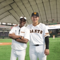 Warren Cromartie (left) spent time working with Giants slugger Kazuma Okamoto during his time as an adviser with the team. | COURTESY OF WARREN CROMARTIE
