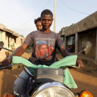 A motorcycle taxi in Kogelo, Kenya, in 2015. Electric motorbike startups have sprung up across East Africa in the past two years to supply and manage the motorbike-taxi drivers who run the most common form of public transport in most cities. | REUTERS