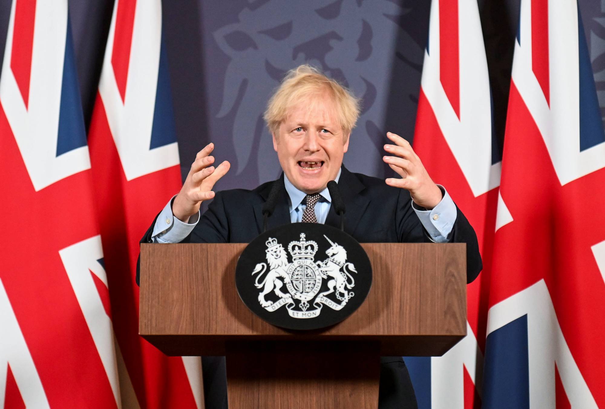 British Prime Minister Boris Johnson holds a news conference in London on Thursday. | Pool / via Reuters 