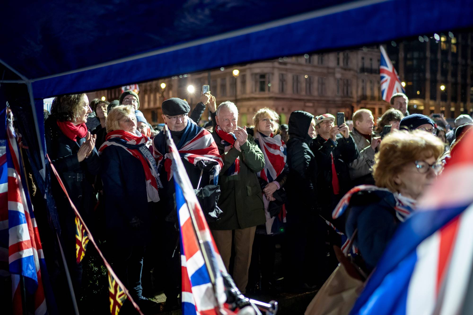 Brexit supporters celebrate in Parliament Square in London on Jan. 30, when the United Kingdom officially left the European Union. | Andrew Testa / The New York Times