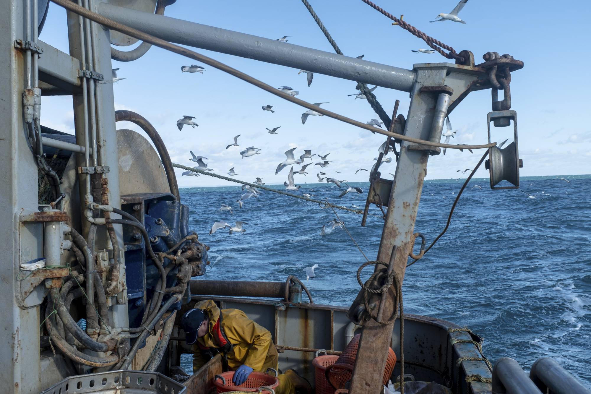 A fishing crew off Brixham, England, in February. The final days of Brexit negotiations came down to fishing rights in British waters. | Andrew Testa / The New York Times