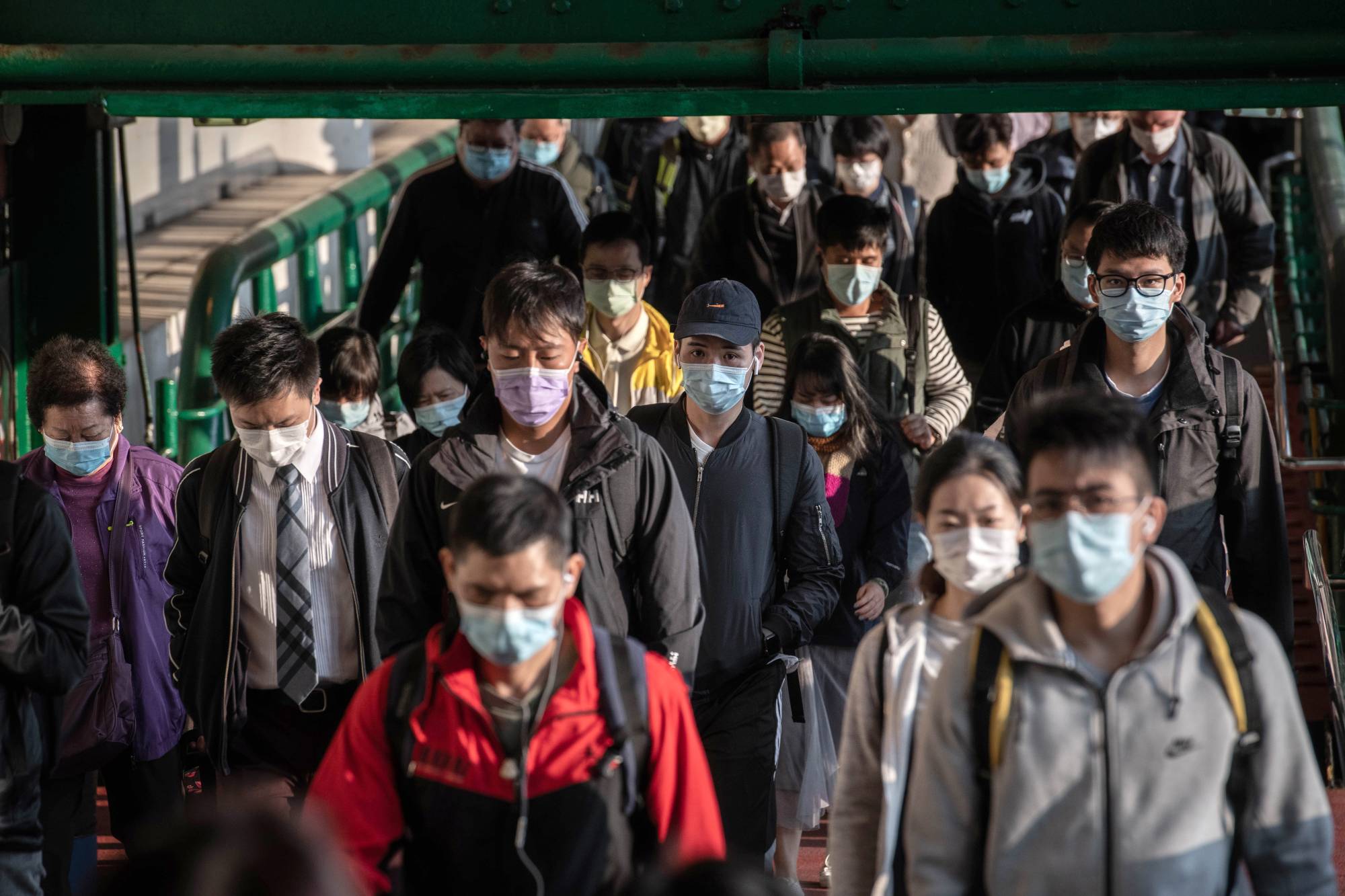Masks, already a common sight in several East Asian nations before the pandemic, have now become ubiquitous as a simple measure against the virus. | BLOOMBERG