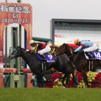 Chrono Genesis (left) wins the Arima Kinen on Sunday at Nakayama Racecourse in Chiba Prefecture. | KYODO