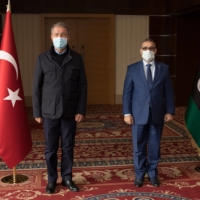 Turkish Minister of Defense Hulusi Akar (left) meets with the head of Libya\'s High Council of State, Khalid Al-Mishri, in Tripoli, on Saturday. | AFP-JIJI