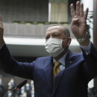 Turkish President Recep Tayyip Erdogan arrives to speak to his ruling party\'s lawmakers in Ankara on Wednesday. | TURKISH PRESIDENCY / VIA AP