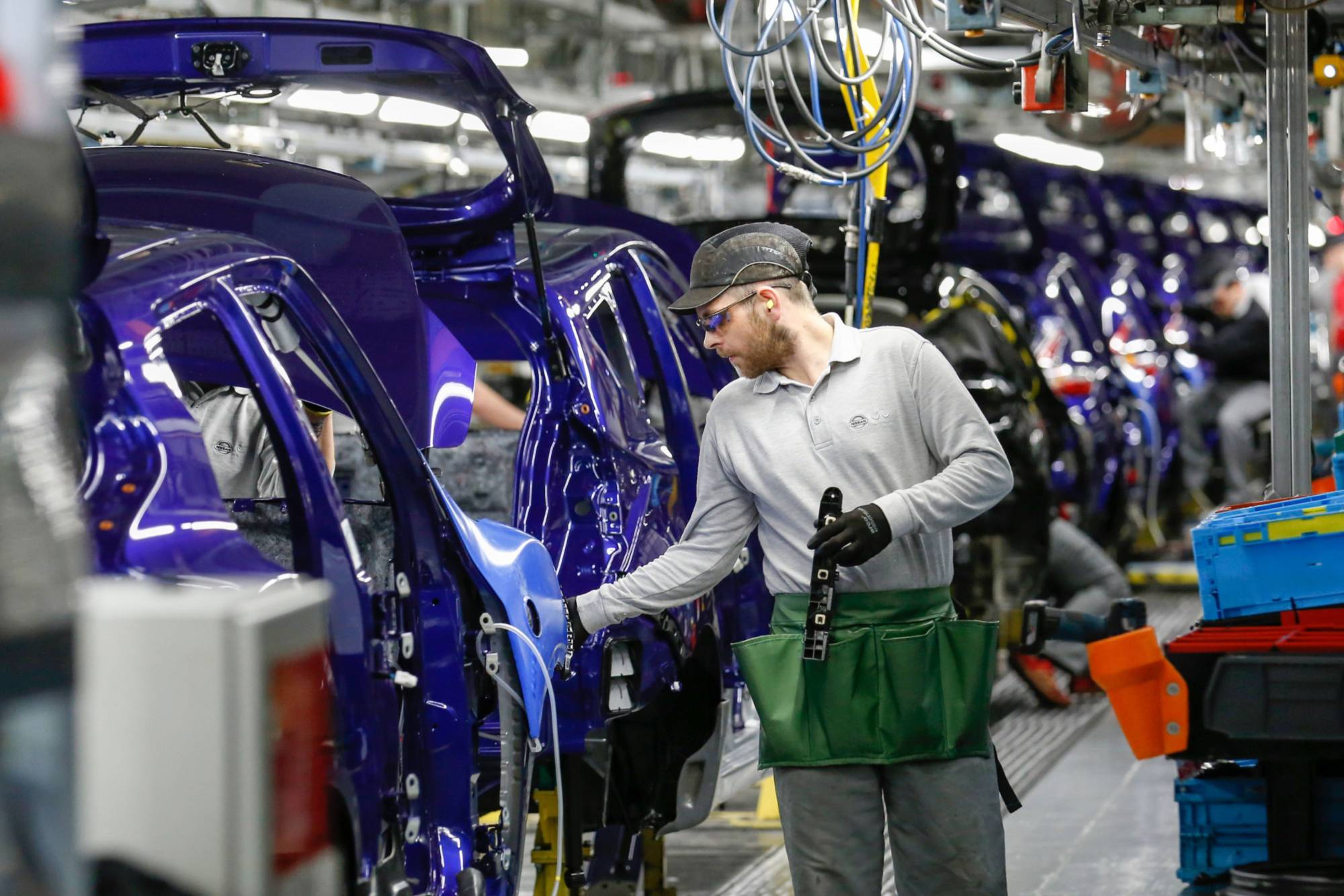 The production line at the Nissan Motor Co. plant in Sunderland, England. The company recently decided against making an electric model at the factory in northeast England and almost two years ago scrapped plans to build another sport utility vehicle at the same site. | BLOOMBERG 
