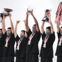 Meisei players celebrate after winning the Winter Cup final on Tuesday. | COURTESY OF THE JAPAN BASKETBALL ASSOCIATION
