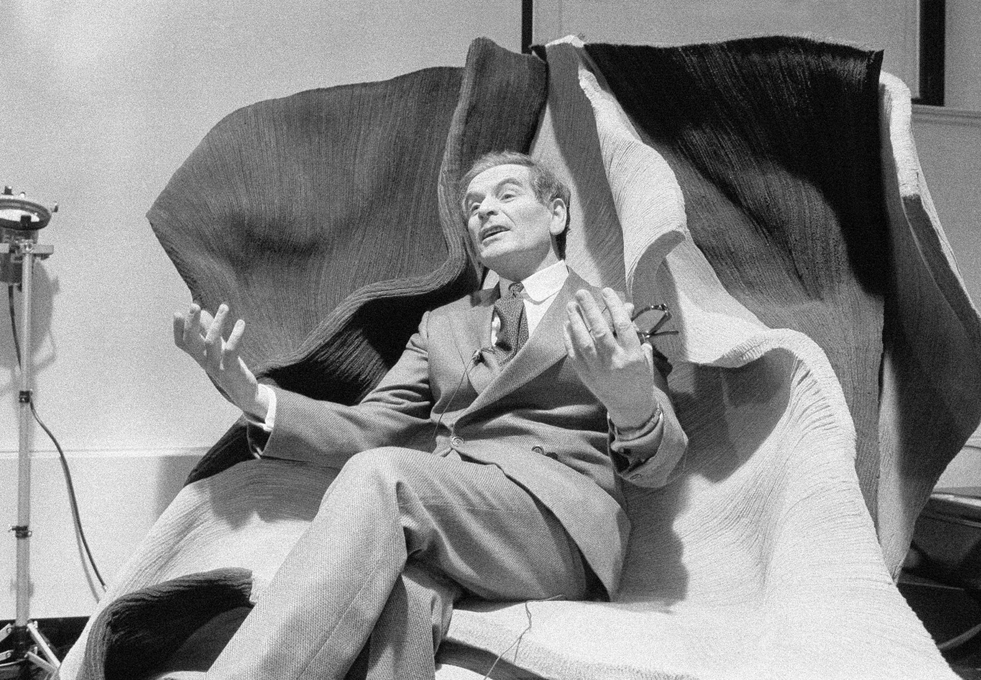 Cardin holds a press conference on his return to the People's Republic of China in March 1979. | AP