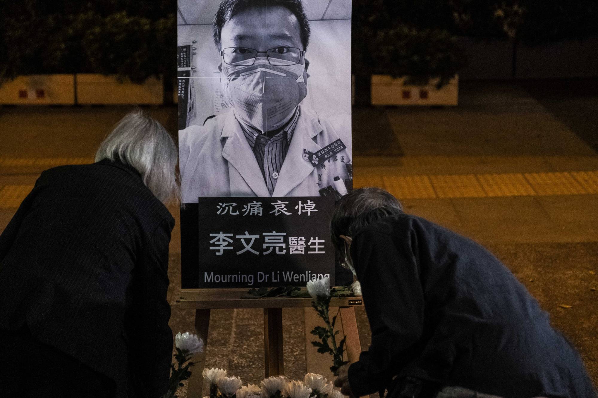 A vigil in Hong Kong on Feb. 7 for Dr. Li Wenliang, who died in Wuhan, China, after the police reprimanded him for raising alarms about the coronavirus | Lam Yik Fei / The New York Times