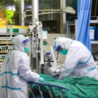COVID-19 patients are treated at Zhongnan Hospital of Wuhan University in January.  | CHINA DAILY / VIA REUTERS 