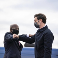 The Rev. Raphael Warnock (left) and Jon Ossoff, the Democratic Senate candidates in Georgia, at a campaign rally in Stonecrest, Georgia on Monday | NICOLE CRAINE / THE NEW YORK TIMES