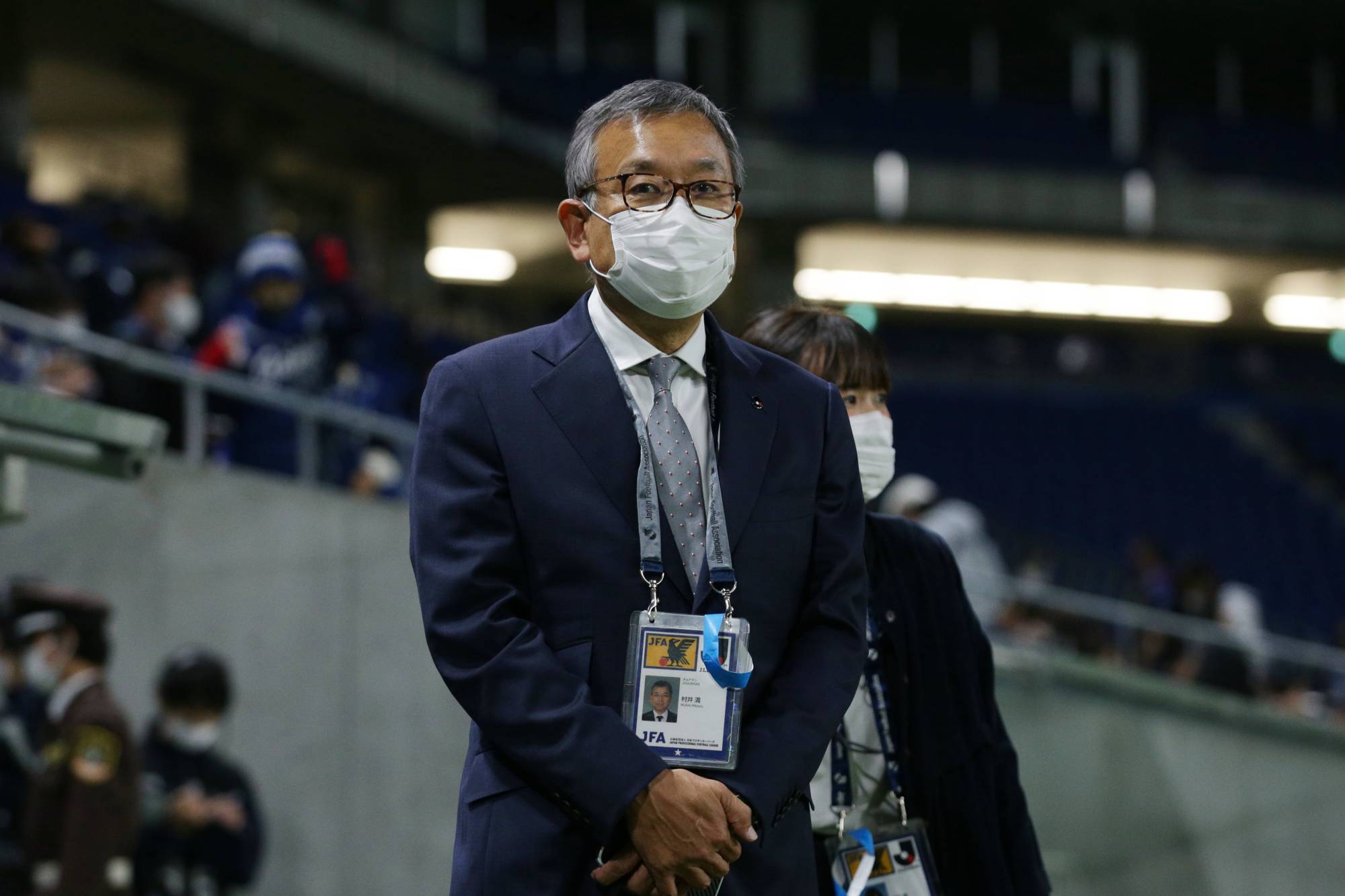 J. League chairman Mitsuru Murai observes a third-division game between Gamba Osaka U-23 and Blaublitz Akita in November. | COURTESY OF THE J. LEAGUE