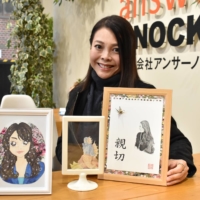 Kaori Watanabe, president of Kofu-based temporary staffing agency Answer Knocks, says three different versions of her own portraits, drawn by the three artists, immediately went viral online, helping spread word of their predicament and triggering an outpouring of goodwill and generosity from across the nation. | TOMOHIRO OSAKI
