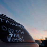 \"#Trump Oppose The Vote\" is written on a car window at Republican Sen. Kelly Loeffler’s \"Senate Firewall Statewide Tour\" campaign stop in Canton, Georgia, on Sunday. | REUTERS