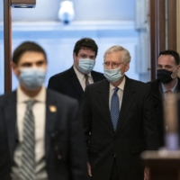 Senate Majority Leader Mitch McConnell arrives at the Capitol in Washington on Sunday, the opening day of the 117th Congress. With U.S. President Donald Trump ratcheting up his efforts to cling to power, the Republican Party has split over whether to back him, posing a major political test. | STEFANI REYNOLDS / THE NEW YORK TIMES