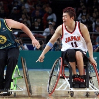 Yasuhiro Jimbo (right) represented Japan in wheelchair basketball at four straight Paralympic Games competitions starting in 1992. | REUTERS