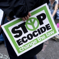 An Extinction Rebellion demonstrator protests outside of The Royal Courts of Justice in London in July 2019. | AFP-JIJI