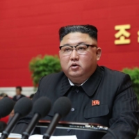 North Korean leader Kim Jong Un speaks during the first day of the 8th Congress of the ruling Workers\' Party of Korea in Pyongyang on Tuesday. | KCNA / KNS / VIA AFP-JIJI
