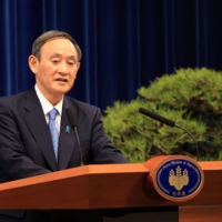 Prime Minister Yoshihide Suga speaks during a news conference at the Prime Minister\'s Office in Tokyo on Monday. | BLOOMBERG