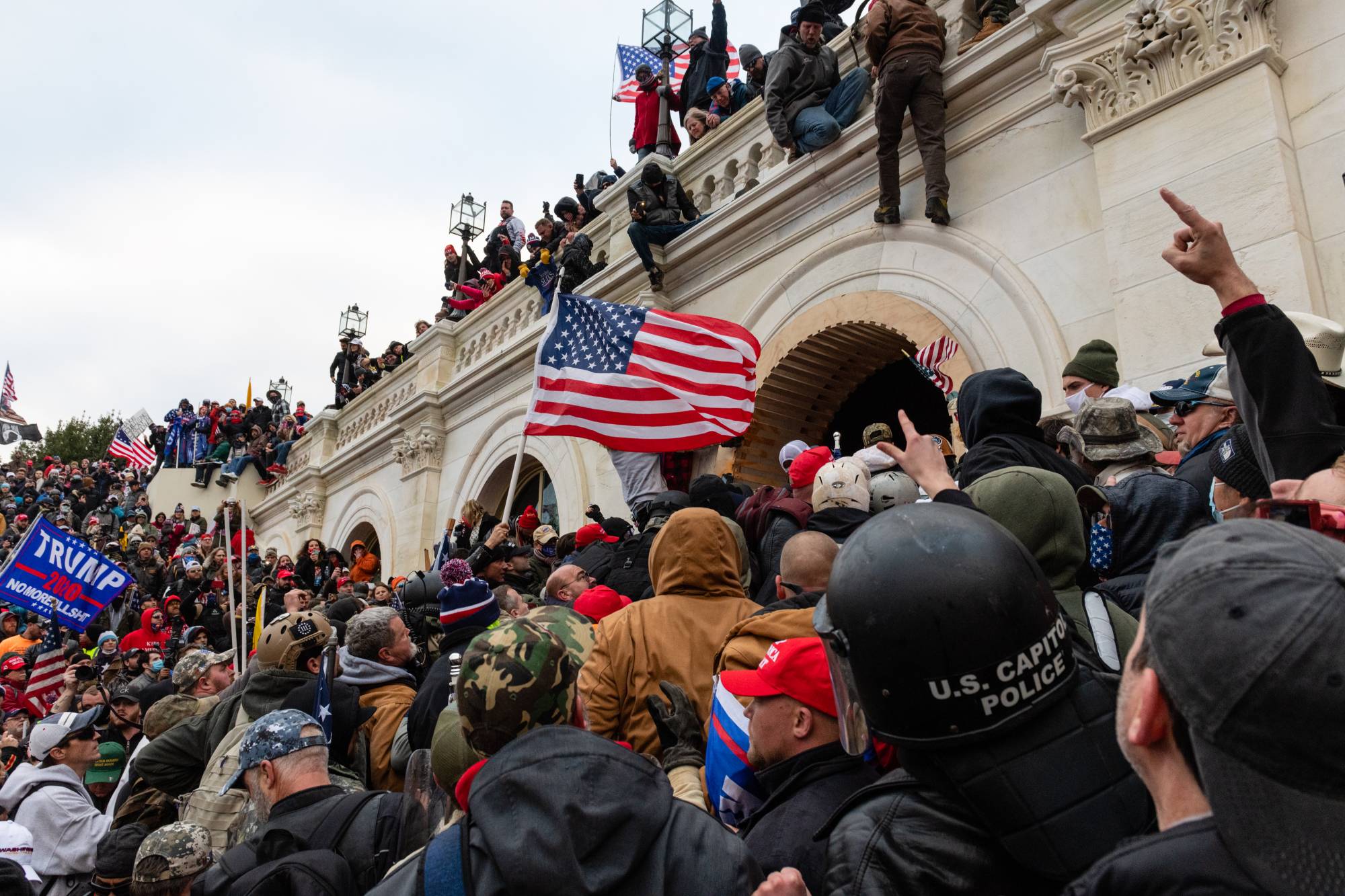 Members of a pro-Trump mob attempt to enter the U.S. Capitol building in Washington on Wednesday.  | BLOOMBERG 