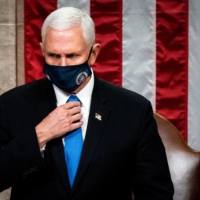 U.S. Vice President Mike Pence presides over a joint session of Congress to certify the 2020 Electoral College results in Washington on Wednesday. | POOL / AFP-JIJI