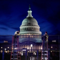 Workers install heavy-duty security fencing around the U.S. Capitol on Thursday, a day after supporters of U.S. President Donald Trump stormed the Capitol in Washington. | REUTERS