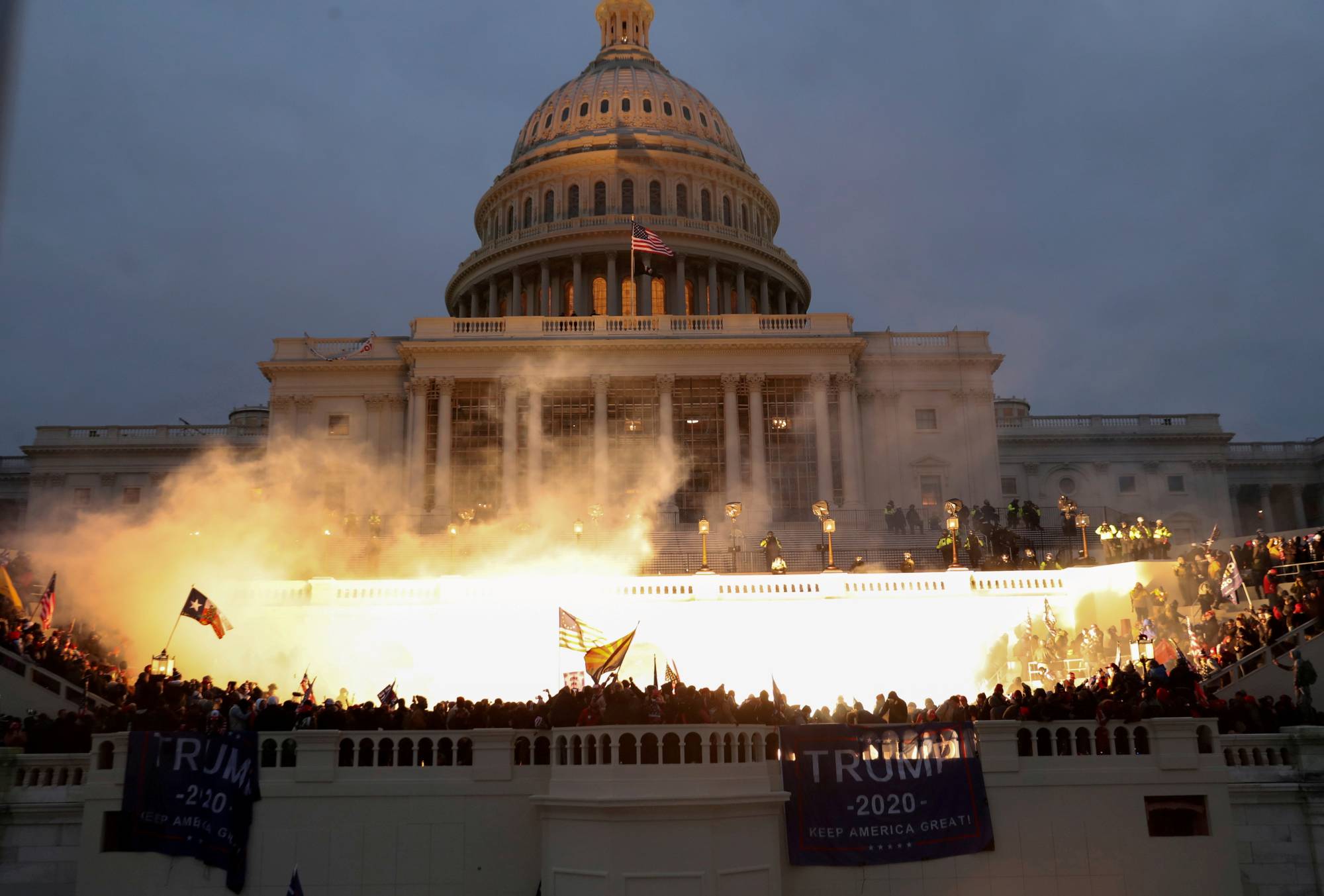 An explosion caused by a police munition is seen while supporters of U.S. President Donald Trump gather in front of the U.S. Capitol in Washington on Wednesday. | REUTERS