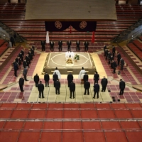 A ceremony is held without sumo wrestlers at Ryogoku Kokugikan to pray for their health and safety during the coronavirus state of emergency on Saturday, a day before the 15-day New Year Grand Sumo Tournament begins. | KYODO