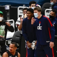 Wizards forward Rui Hachimura (center) reacts to a play during Saturday\'s game against the Heat in Washington. | USA TODAY / VIA REUTERS
