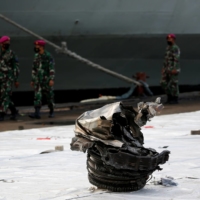 A piece of debris found in the sea that is believed to be from a turbine of Sriwijaya Air flight SJ182 is seen at Tanjung Priok port in Jakarta on Monday. | REUTERS