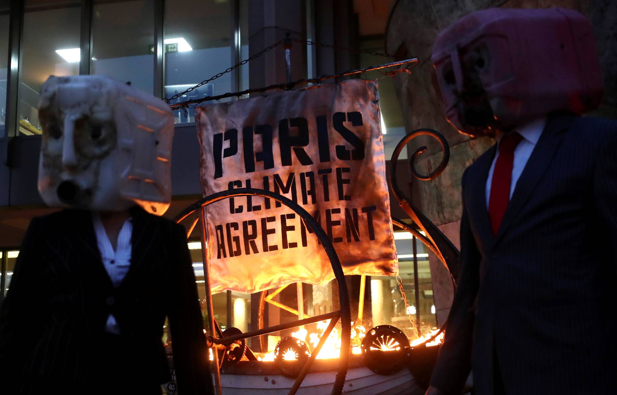 Ocean Rebellion protesters demonstrate outside the International Maritime Organisation headquarters in London in November. Britain and countries in the European Union in December committed to stronger emissions reductions targets for 2030. | REUTERS