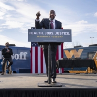 Rev. Raphael Warnock, a Democratic Senate candidate in Georgia, speaks at a campaign rally in Stonecrest, Georgia, on Dec. 28. | NICOLE CRAINE / THE NEW YORK TIMES
