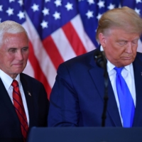 U.S. President Donald Trump and Vice President Mike Pence speak at the White House in Washington on Nov. 4. | AFP-JIJI