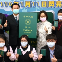 Taiwan\'s Foreign Minister, Joseph Wu, takes photos with a sample of the new Taiwanese passport in Taipei on Monday.  | REUTERS 