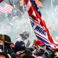 Supporters of U.S. President Donald Trump react to tear gas outside of the Capitol building in Washington last Wednesday.  | REUTERS 