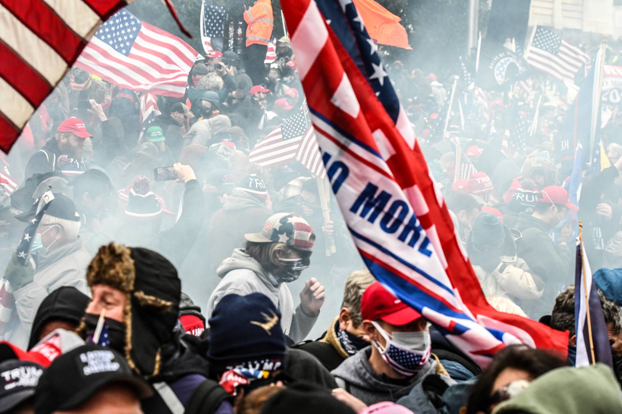 Supporters of U.S. President Donald Trump react to tear gas outside of the Capitol building in Washington last Wednesday. | Reuters 