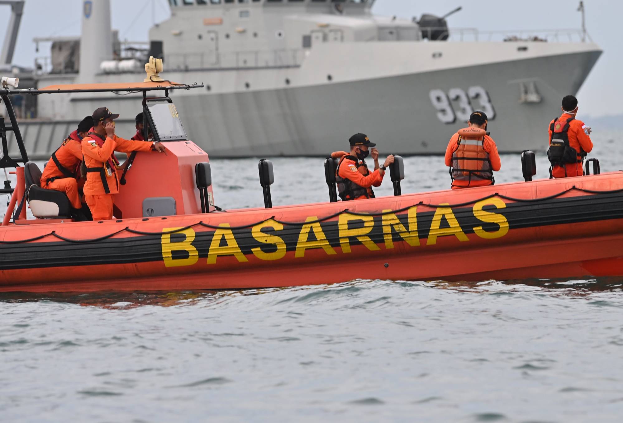 A search and rescue team conducts operations near Lancang Island on Sunday. | AFP-Jiji
