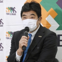 Top League Chairman Osamu Ota speaks during a news conference on March 23, 2020. | KYODO