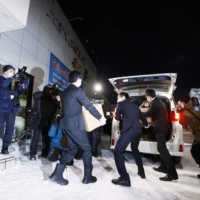 Tokyo prosecutors search the office of former farm minister Takamori Yoshikawa in Sapporo on Dec. 25. for evidence of his involvement in a bribery case. | KYODO