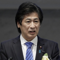 Norihisa Tamura, Japan\'s health minister, speaks during an event in Tokyo on Dec. 24. | BLOOMBERG