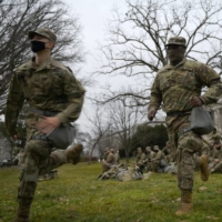 Officers from the National Guard gather on Capitol grounds in Washington on Friday, days ahead of U.S. President-elect Joe Biden\'s inauguration. | REUTERS