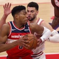 Wizards forward Rui Hachimura looks to pass while being guarded by the Bulls\' Zach LaVine during the first half in Washington on Dec. 31, 2020. | USA TODAY / VIA REUTERS