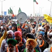 Farmers protest against the central government\'s recent agricultural reforms as Prime Minister Narendra Modi addresses the nation on a radio program, in Ghazipur, along the Delhi-Uttar Pradesh state border, in December.  | AFP-JIJI