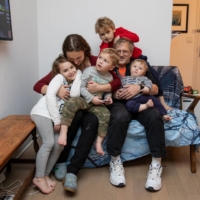 Paraskevi Briasouli and her husband, Jesse Tayler, with their children at their home in New York on Friday  | JACKIE MOLLOY / THE NEW YORK TIMES