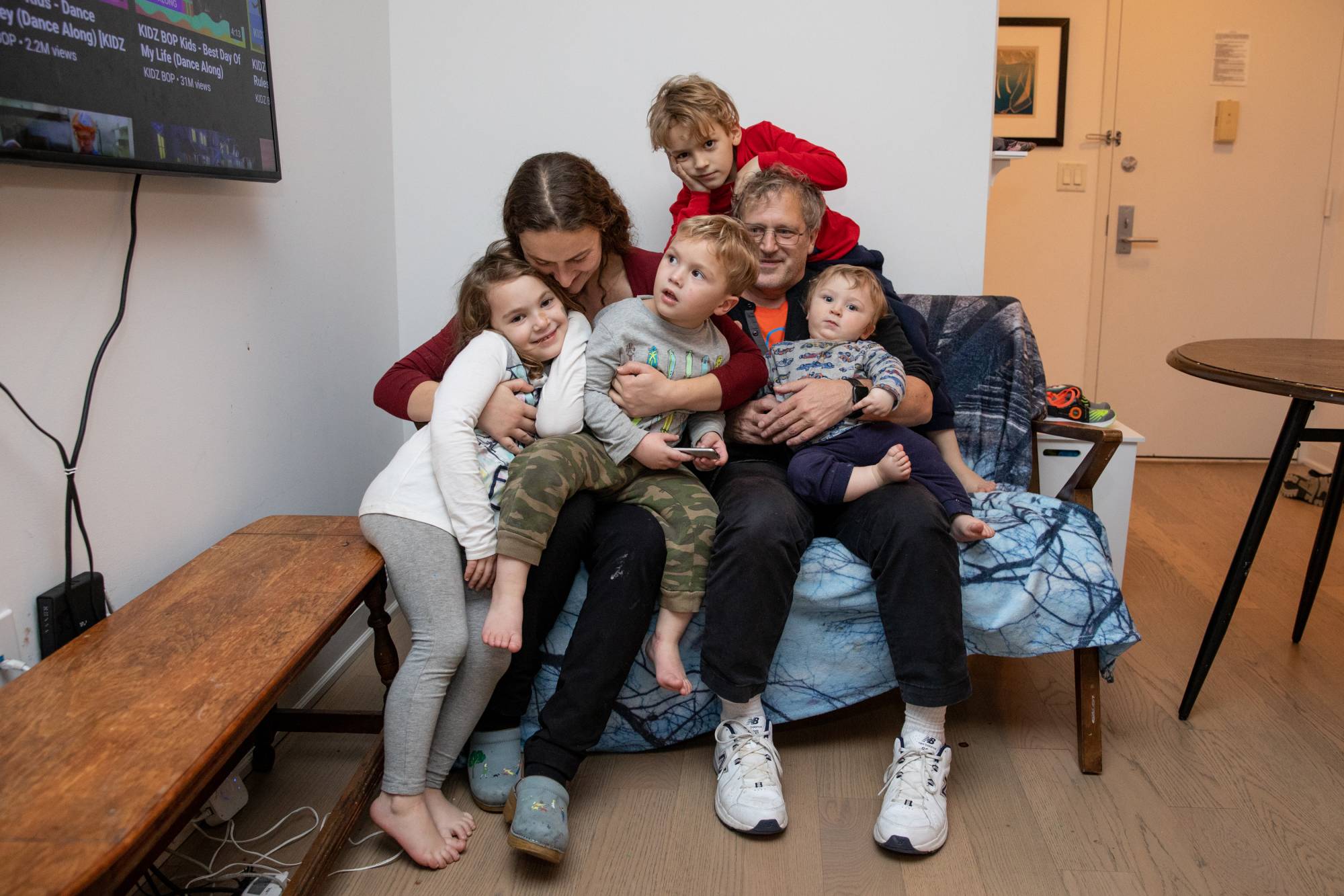Paraskevi Briasouli and her husband, Jesse Tayler, with their children at their home in New York on Friday | Jackie Molloy / The New York Times