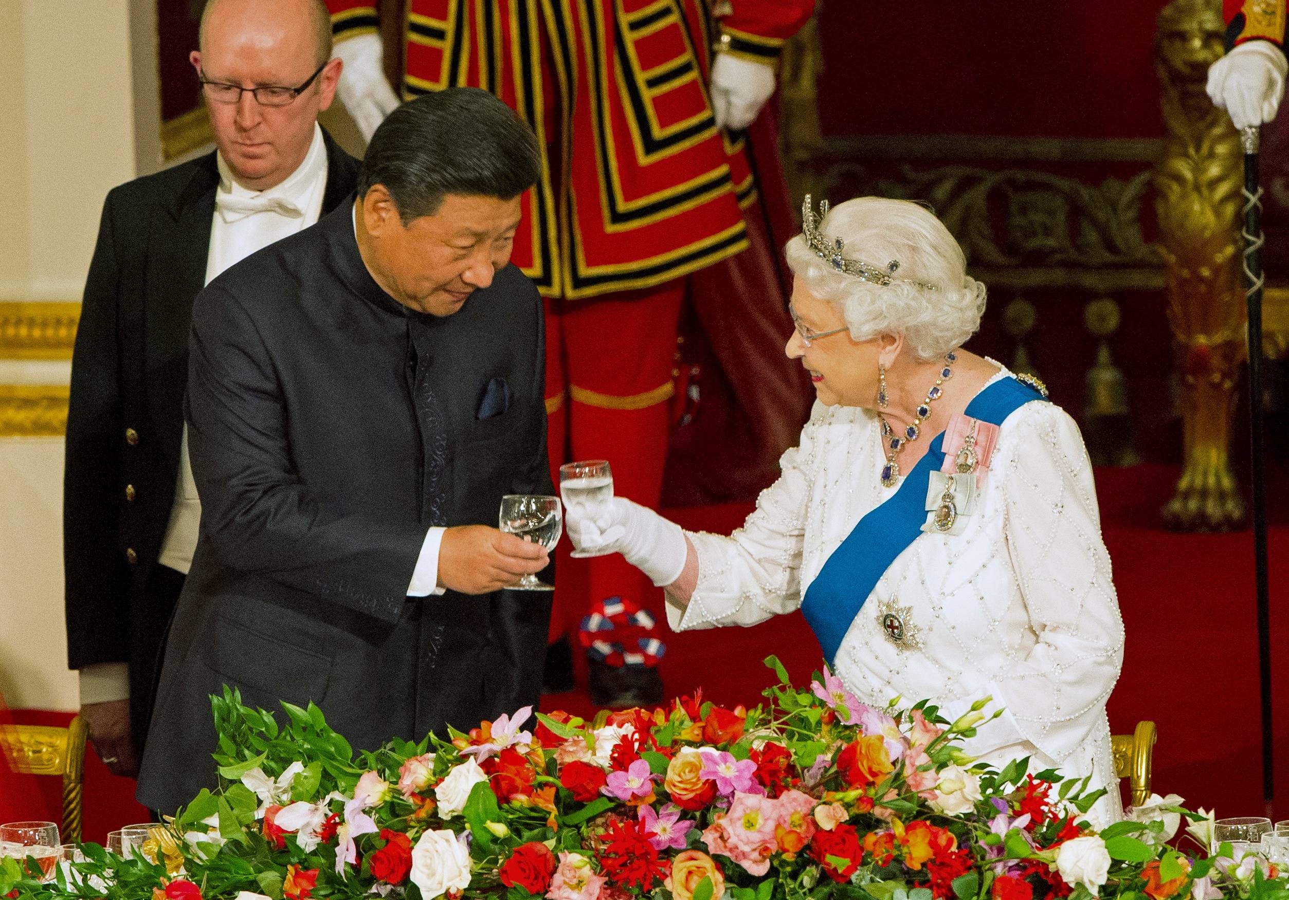 London was seen to be cozying up to Beijing under the leadership of then-Prime Minister David Cameron, culminating in a meeting between Chinese President Xi Jinping and Queen Elizabeth II in 2015. | Pool / Via Reuters