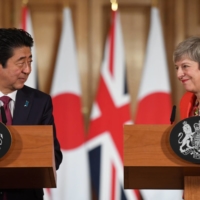 Britain\'s then-Prime Minister Theresa May and then-Prime Minister Shinzo Abe enjoyed a good relationship, with meetings in 2017 and 2019. | POOL / VIA REUTERS
