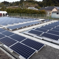 ELM Inc. has installed solar panels on the surface of swimming pools at an abandoned school in Minamisatsuma, Kagoshima Prefecture, in a move the firm says is a first for Japan. | KYODO