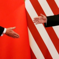 U.S. President Donald Trump and China\'s President Xi Jinping shake hands after making joint statements at the Great Hall of the People in Beijing on Nov. 9, 2017. | REUTERS