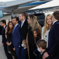 Members of Donald Trump\'s family listen to a speech by the president at Joint Base Andrews in Maryland on Wednesday. | REUTERS